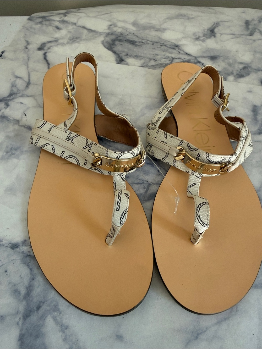 Calvin Klein Cream Logo Print T-Strap Sandals with Gold Accents